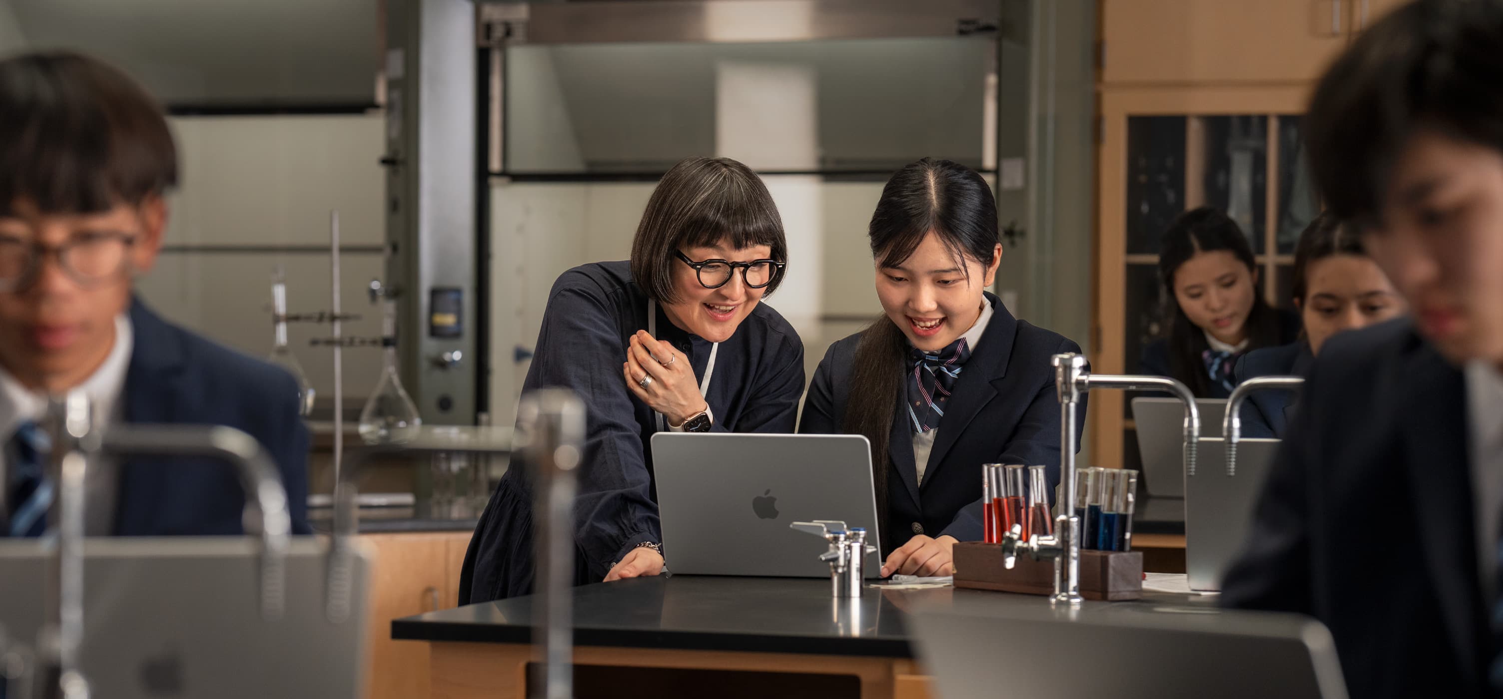 MacBook open in laboratory setting